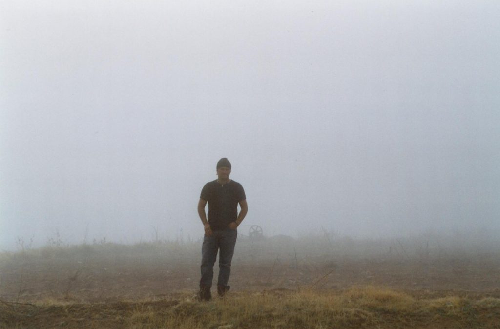 Jason standing in the fog in Romania